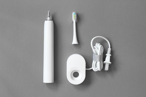 Electric toothbrush in packing material